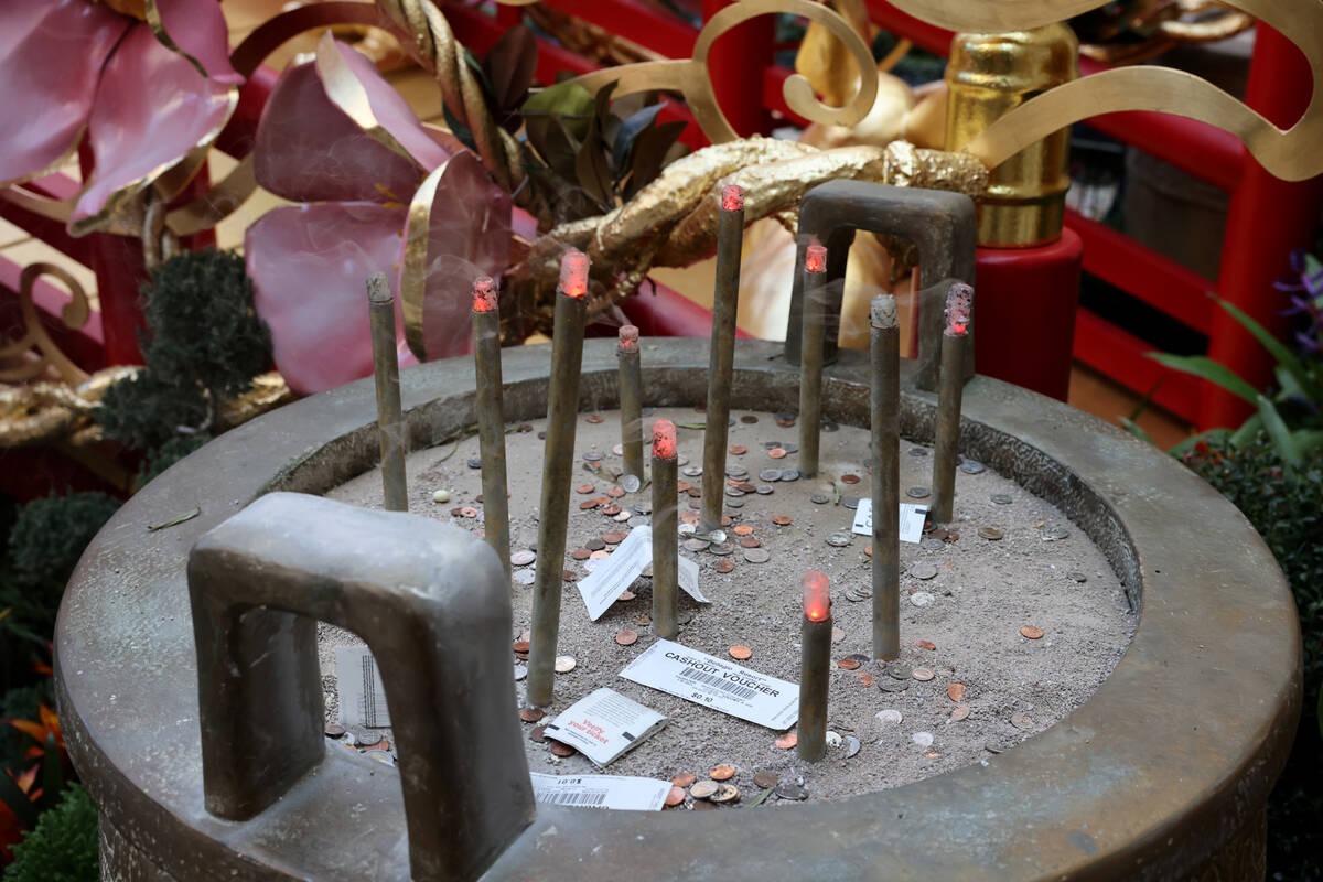 Simulated incense in a ding pot is part of the Year of the Rabbit display celebrating Lunar New ...