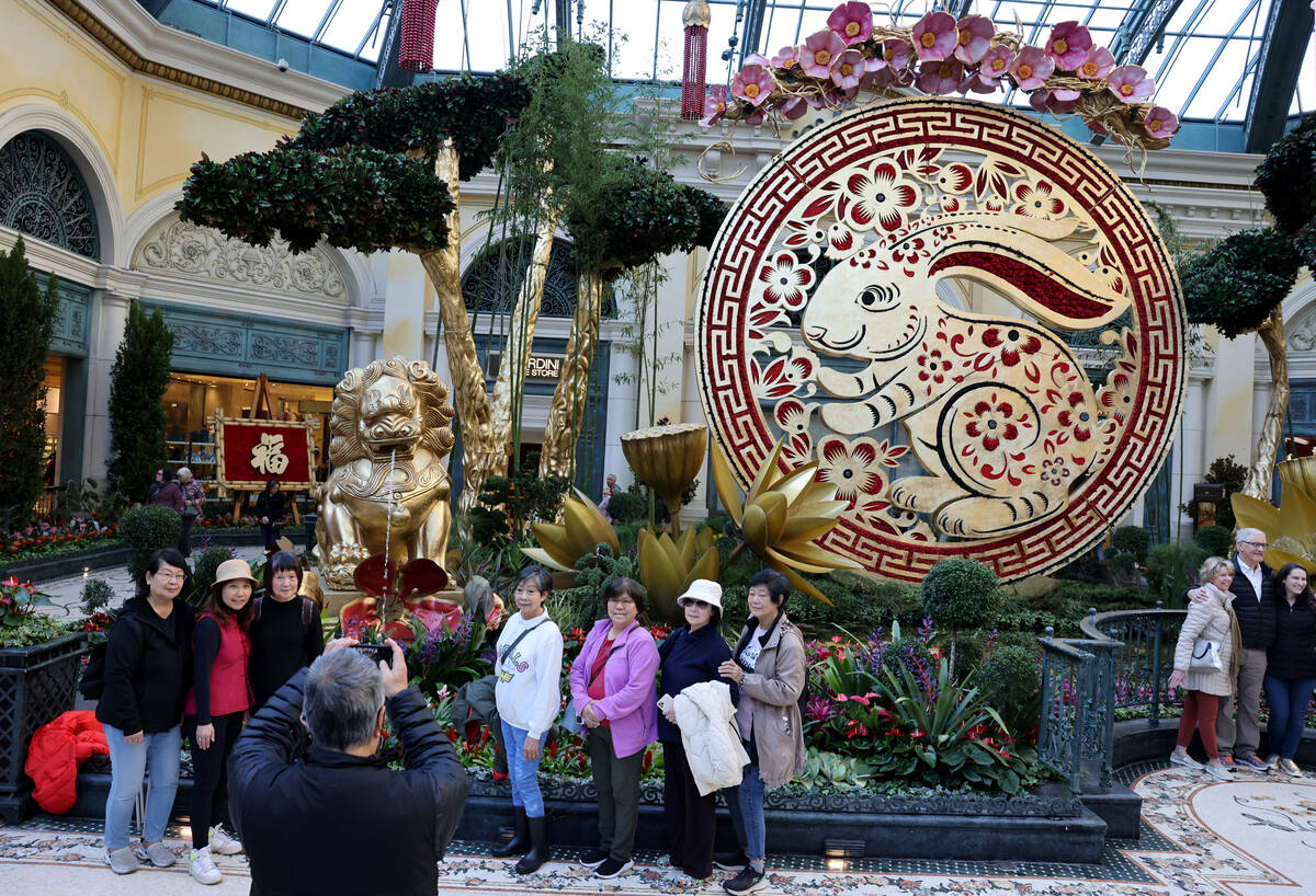 Guests take in the Year of the Rabbit display celebrating Lunar New Year at the Bellagio Conser ...