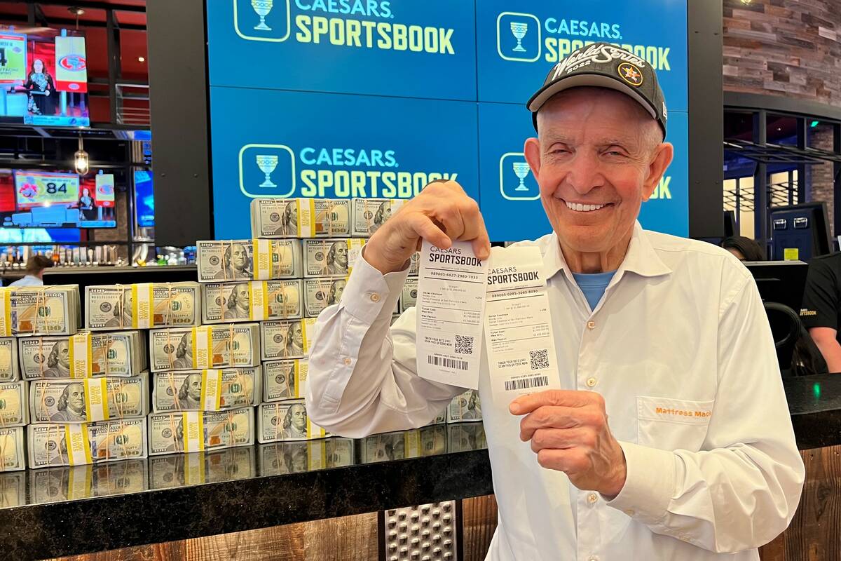 Jim "Mattress Mack" McIngvale holds up $2 million in bets on the Dallas Cowboys to beat the San ...