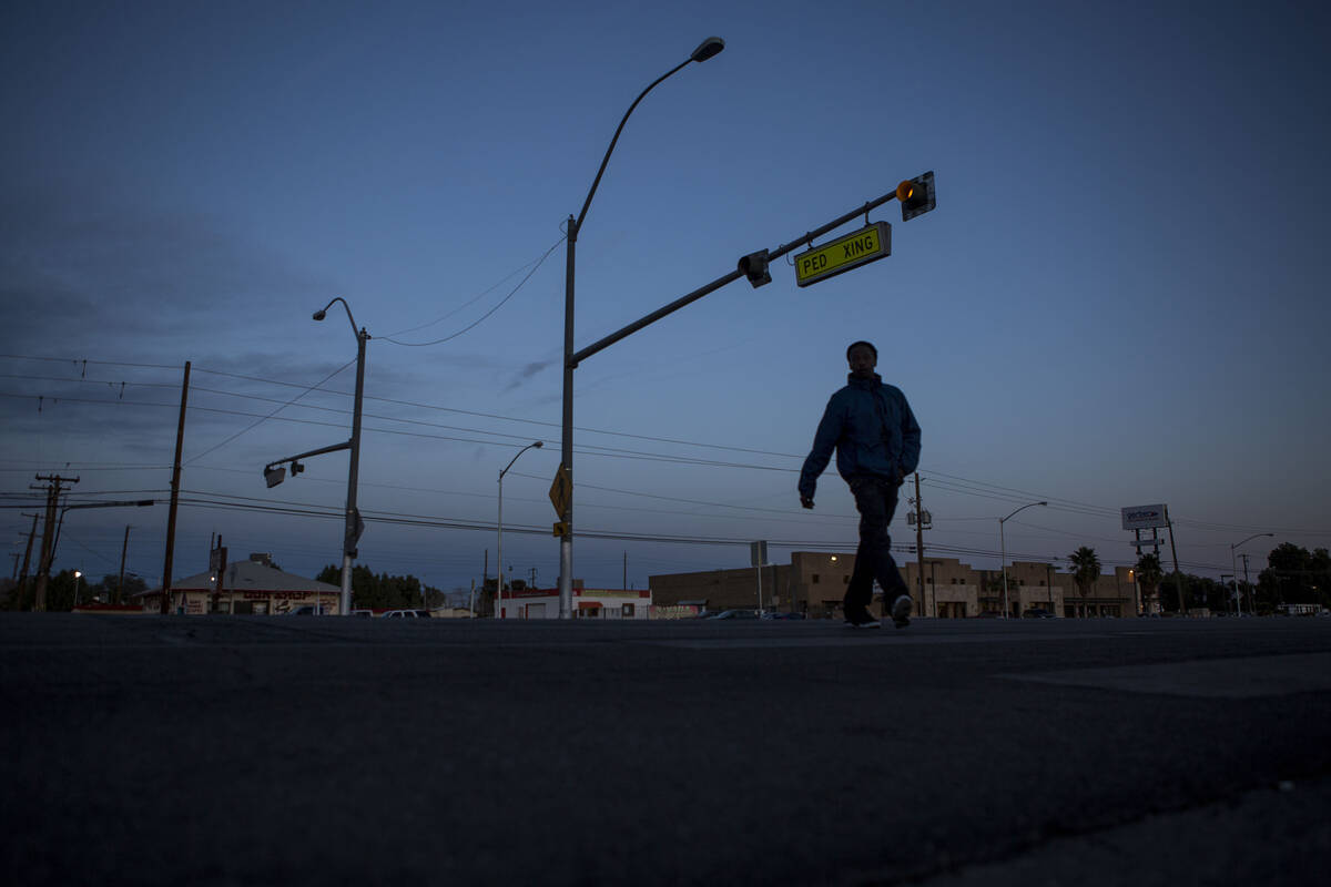 FILE - A pedestrian uses the crosswalk at the intersection of Whitney Avenue and Boulder Highwa ...