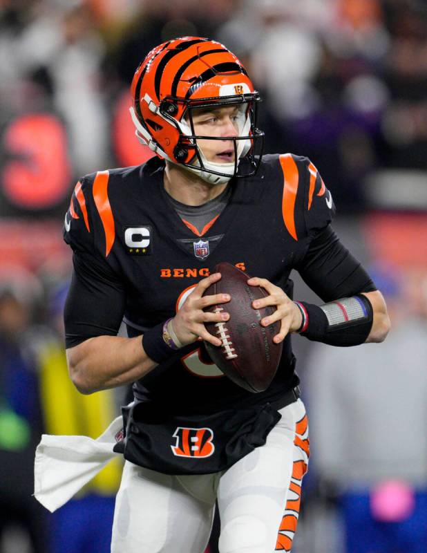 Cincinnati Bengals quarterback Joe Burrow plays during a wild-card playoff NFL football game ag ...