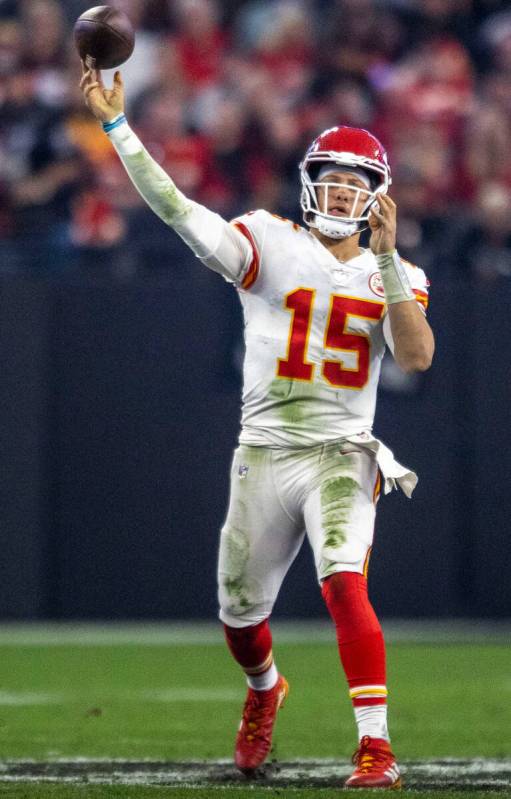 Kansas City Chiefs quarterback Patrick Mahomes (15) throws against the Raiders during the secon ...
