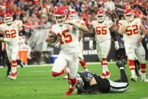 Kansas City Chiefs quarterback Patrick Mahomes (15) runs the ball past Raiders defensive end Ma ...