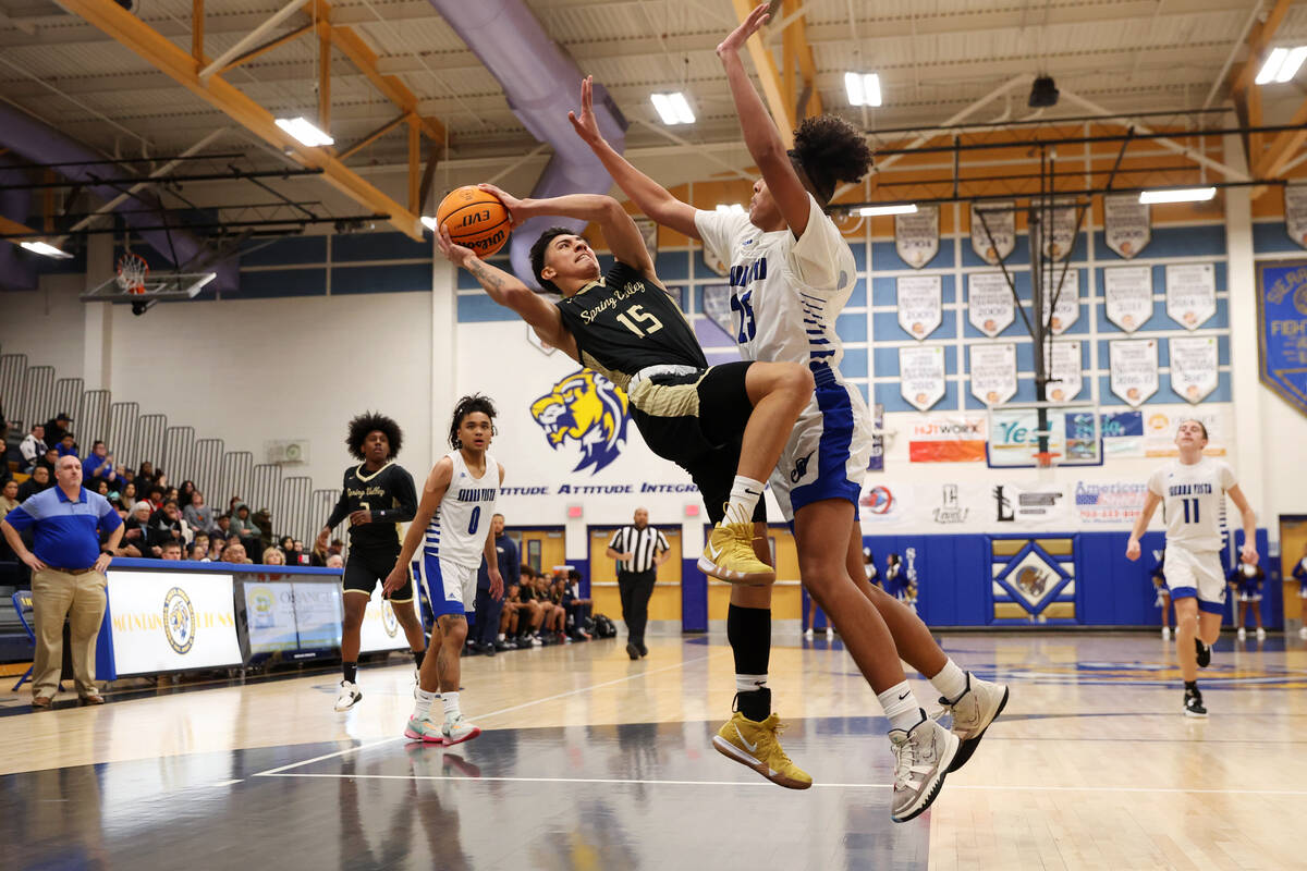 Spring Valley's Osvaldo Biebrich (15) takes a shot under pressure from Sierra Vista's Jeremie W ...