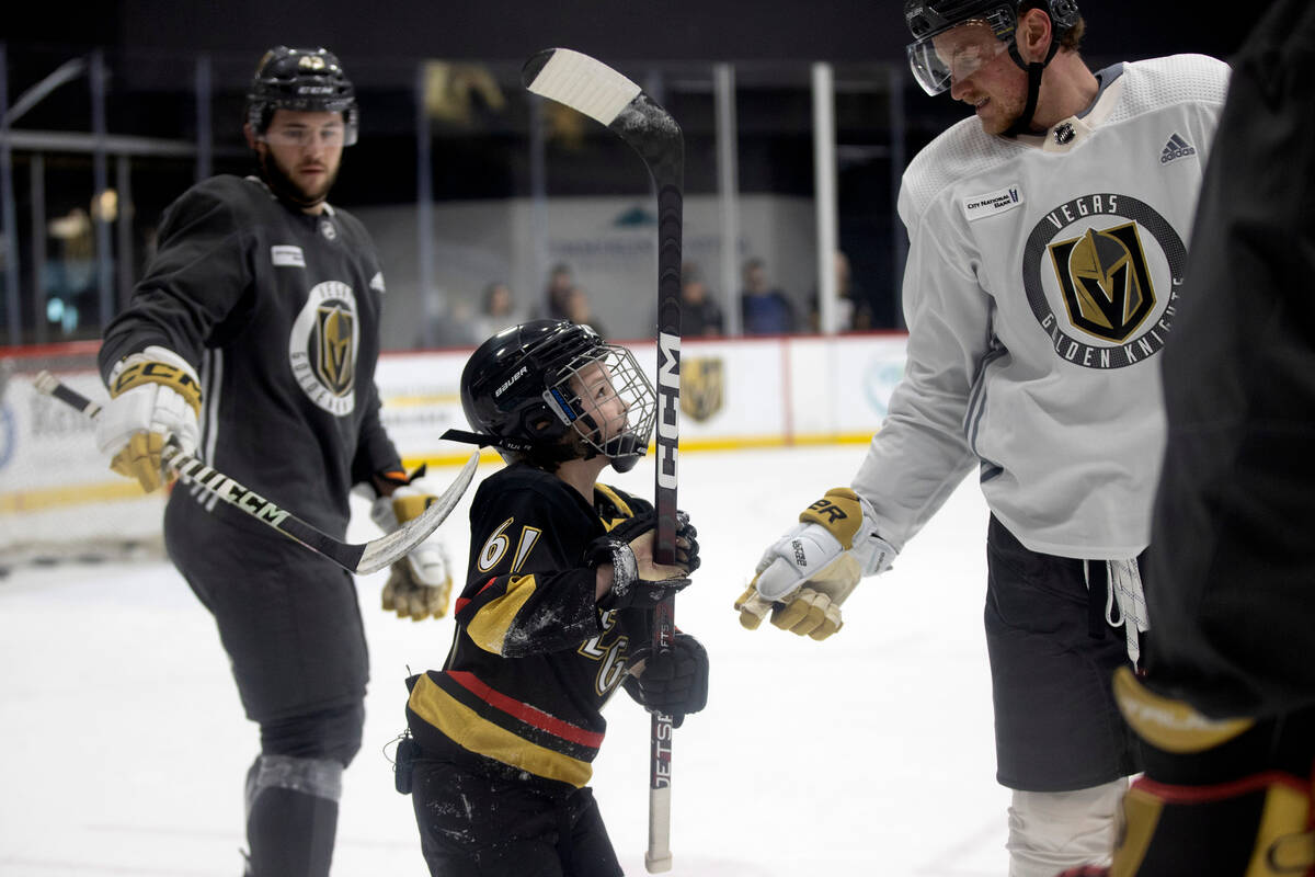 Annabelle Hanson, 8, chats with Golden Knights center Jack Eichel during practice City National ...
