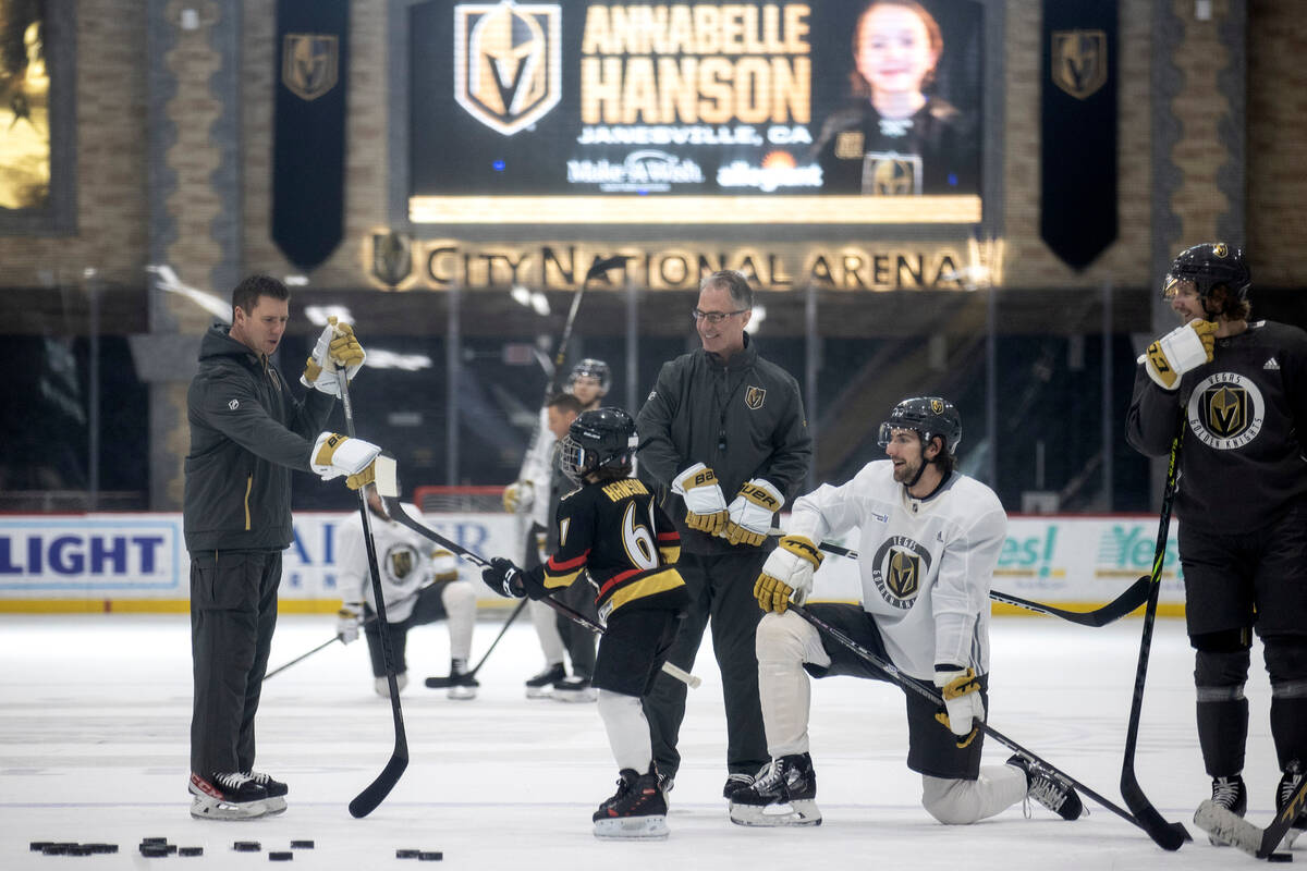 Annabelle Hanson, 8, joins the Golden Knights on the ice during practice City National Arena on ...