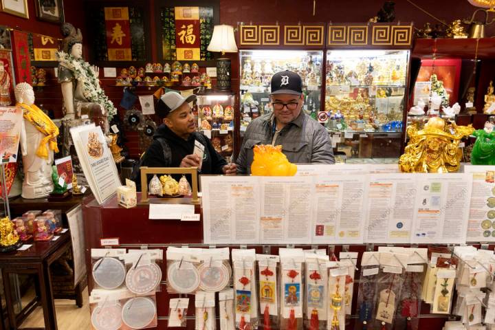 Cyrus Pope, left, and Jeff McPherson, both of Houston, Texas, shop at World of Feng Shui on Thu ...