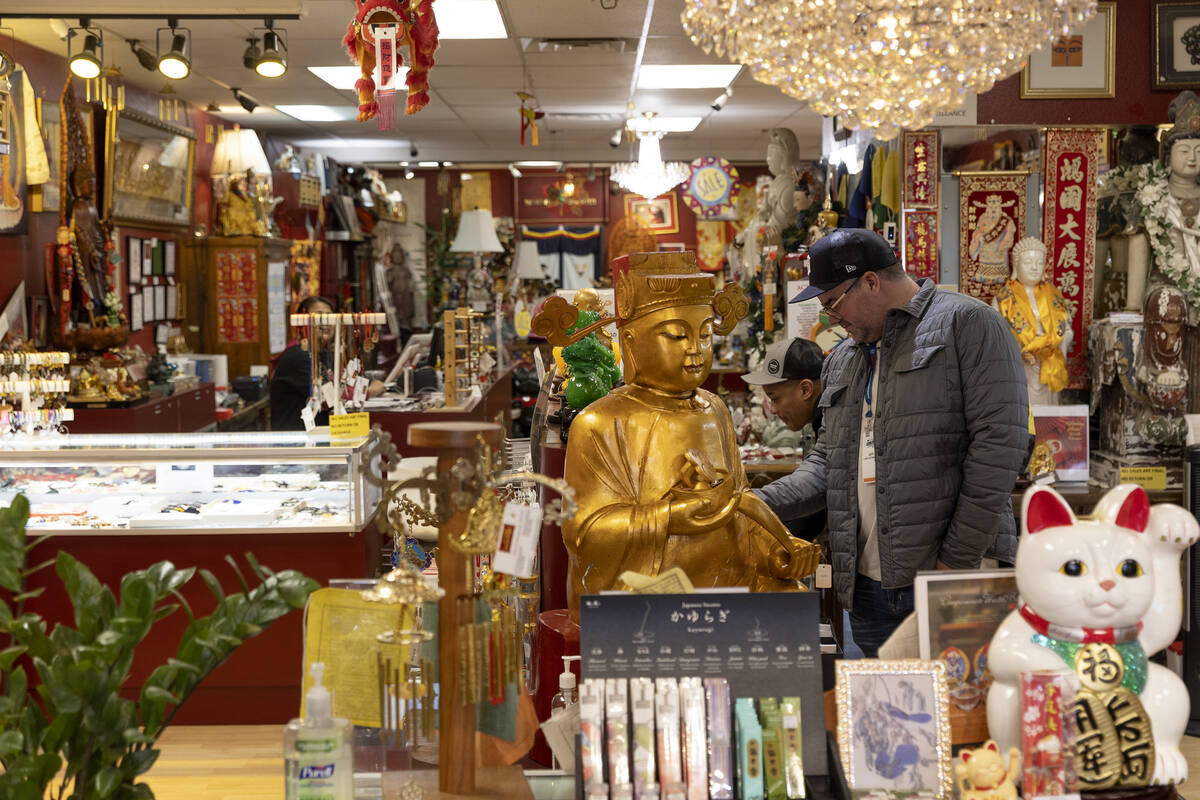 Shoppers browse for goods at World of Feng Shui on Thursday, Jan. 19, 2023, in Las Vegas. World ...