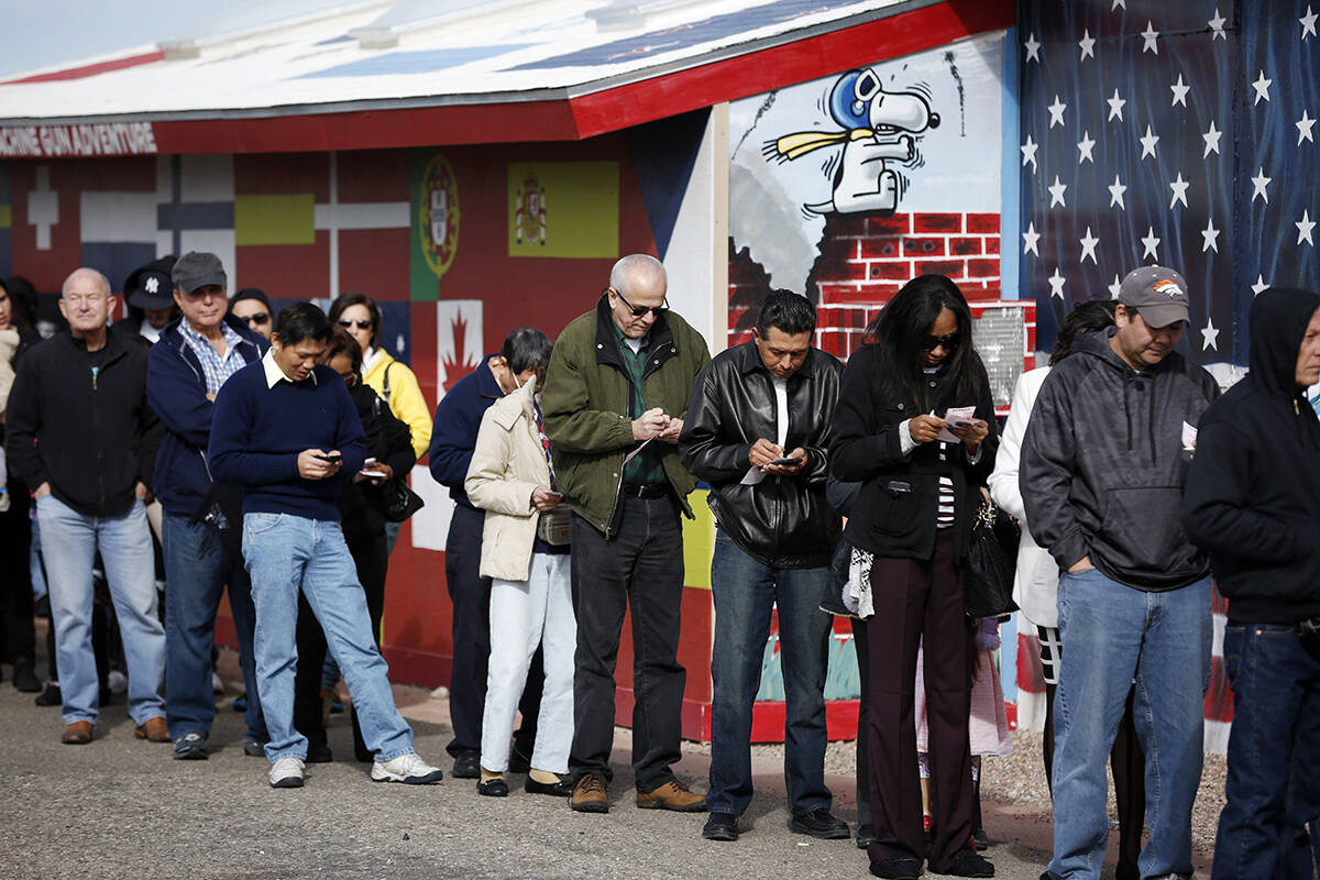 FILE--Customers wait in line at The Last Stop to buy Powerball lottery tickets Sunday, Jan. 10, ...