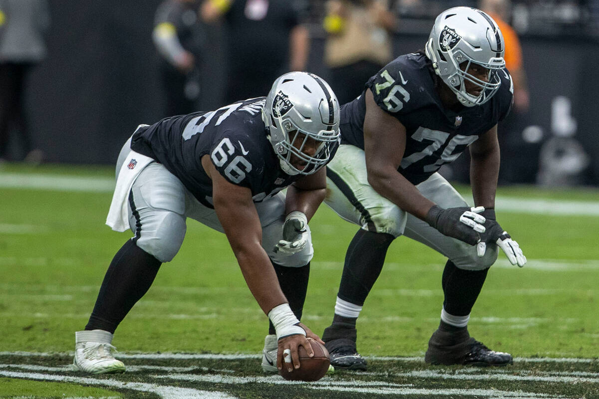 Raiders guard Dylan Parham (66) and Raiders guard John Simpson (76) get ready on the line of sc ...