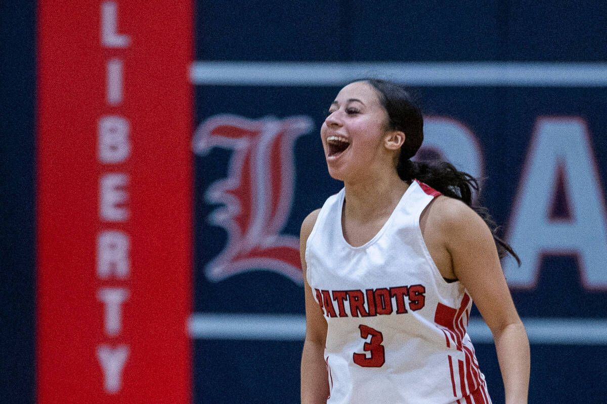 Liberty guard Jaden Newman (3) celebrates another 3-point basket over Coronado during the secon ...