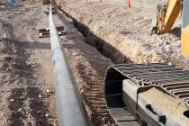 A construction crew digs a trench for replacing a Southwest Gas pipeline in the area of the Jer ...