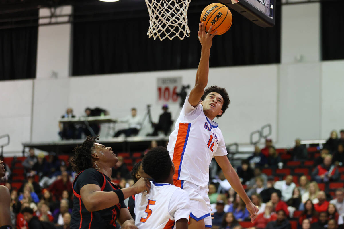 Bishop Gorman's Quentin Rhymes (12) shoots the ball during the first half of a Big City Showdow ...