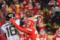 Kansas City Chiefs cornerback Jaylen Watson (35) pressures Jacksonville Jaguars quarterback Tre ...