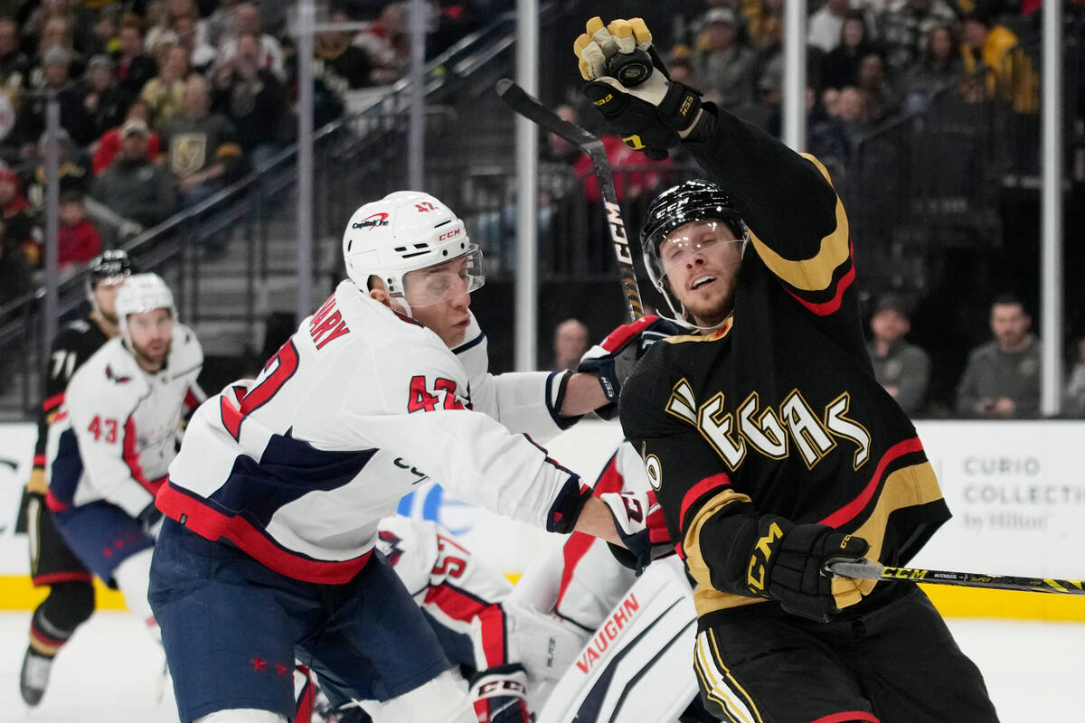 Vegas Golden Knights right wing Jonas Rondbjerg (46) knocks the puck out of the air against Was ...