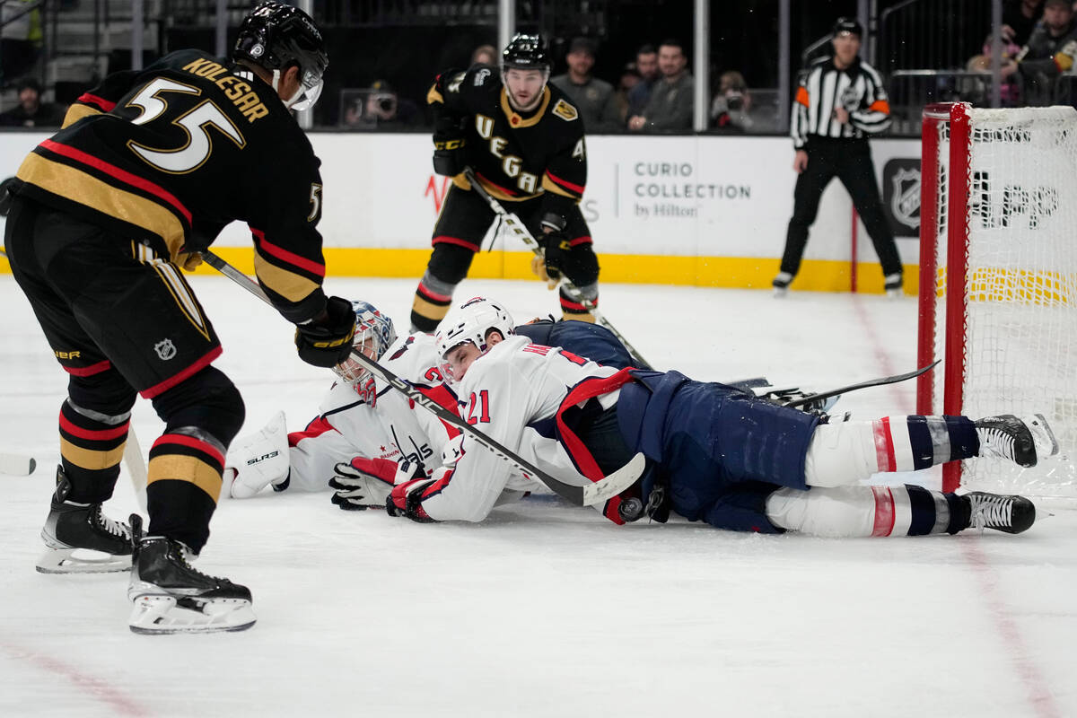 Washington Capitals right wing Garnet Hathaway (21) stops a shot by Vegas Golden Knights right ...