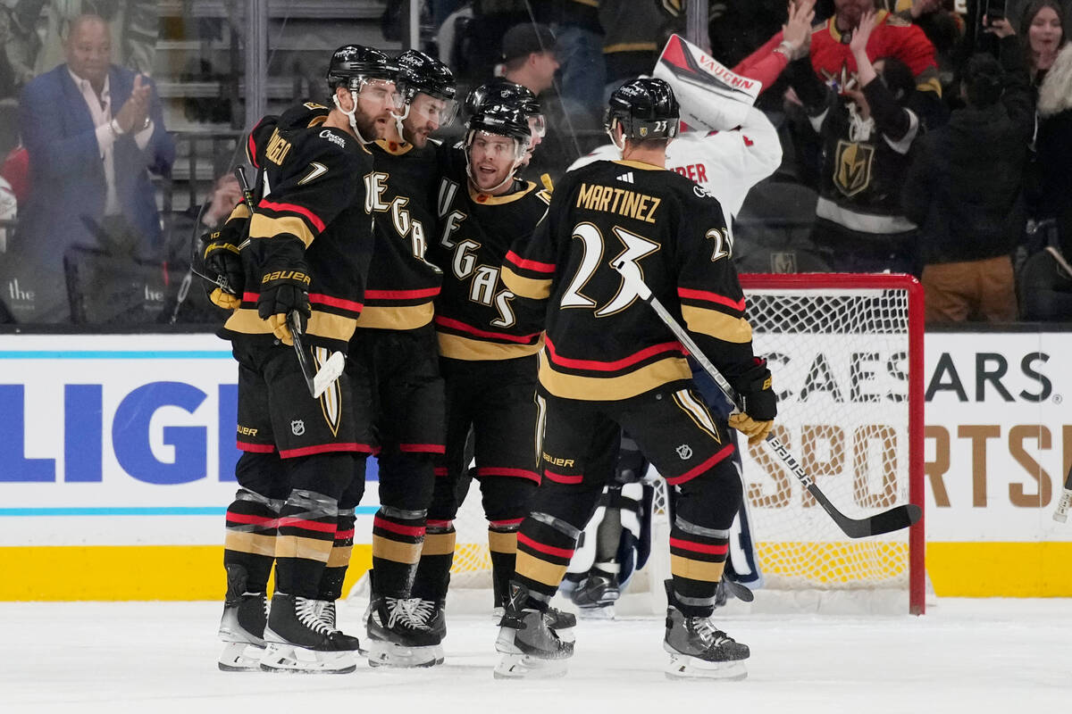 Vegas Golden Knights celebrate after center Nicolas Roy, second from left, scored against the W ...