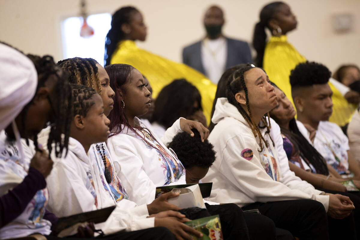 The family of Ashari Hughes listen to prayers during a memorial at New Bethel Baptist Church on ...