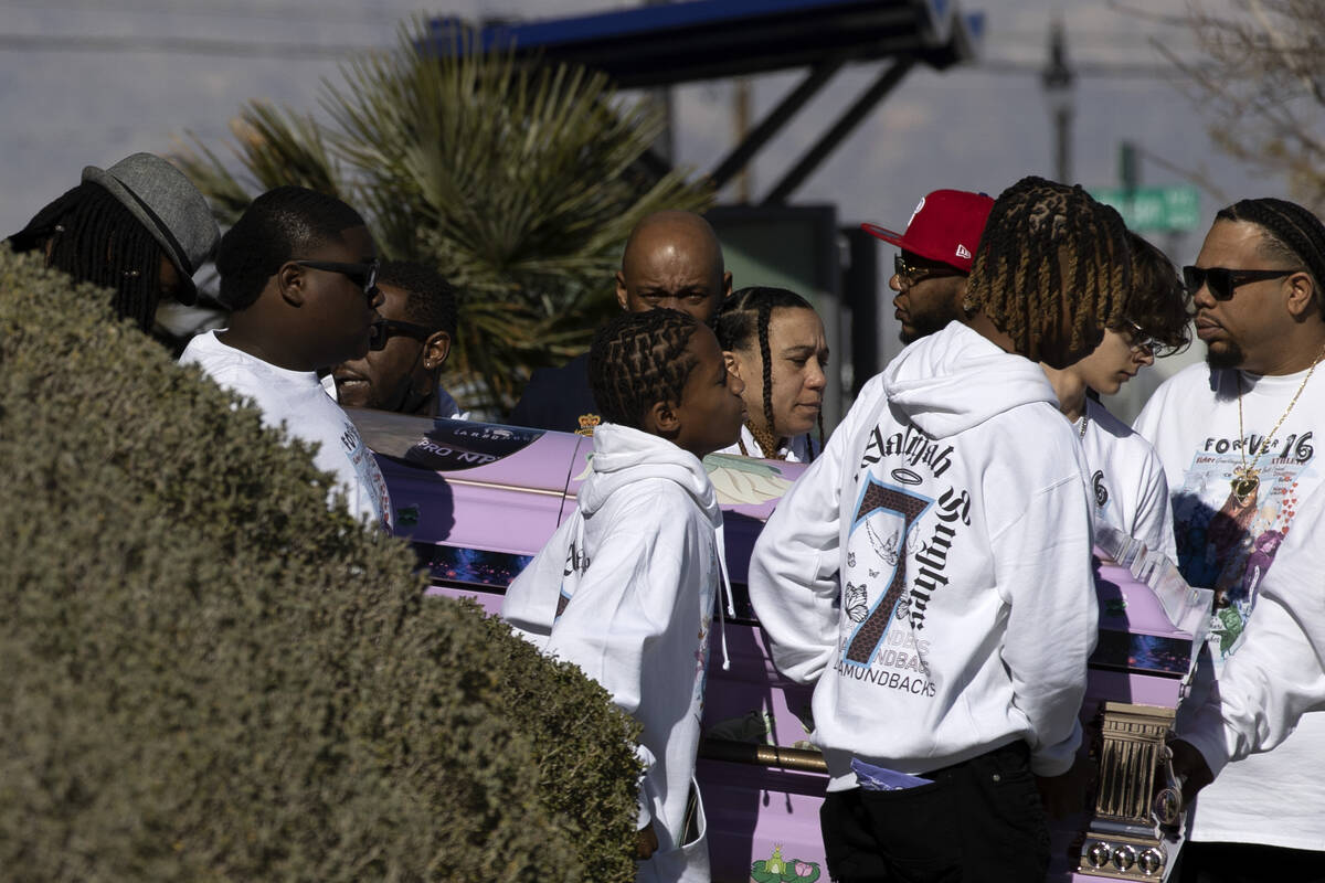Ashari Hughes’ casket is carried out by family members after her memorial at New Bethel ...