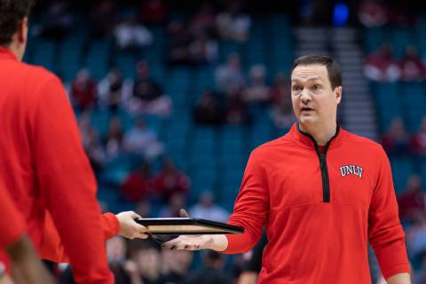 UNLV Rebels head coach Kevin Kruger prepares for a timeout during the second half of an NCAA co ...