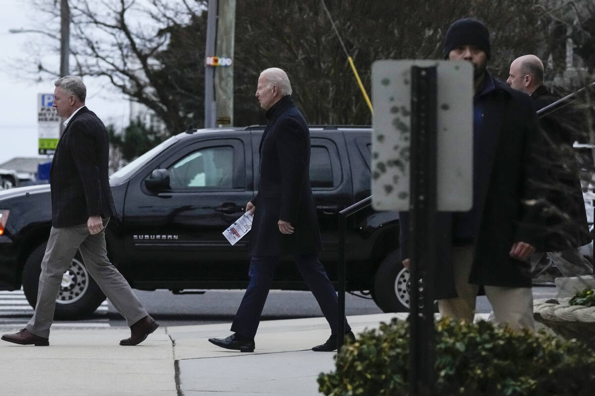 President Joe Biden walks from St. Edmund Roman Catholic Church after attending Mass in Rehobot ...