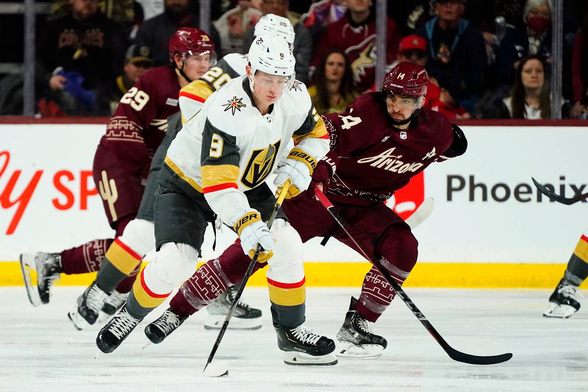 Vegas Golden Knights center Jack Eichel (9) skates with the puck against Arizona Coyotes defens ...