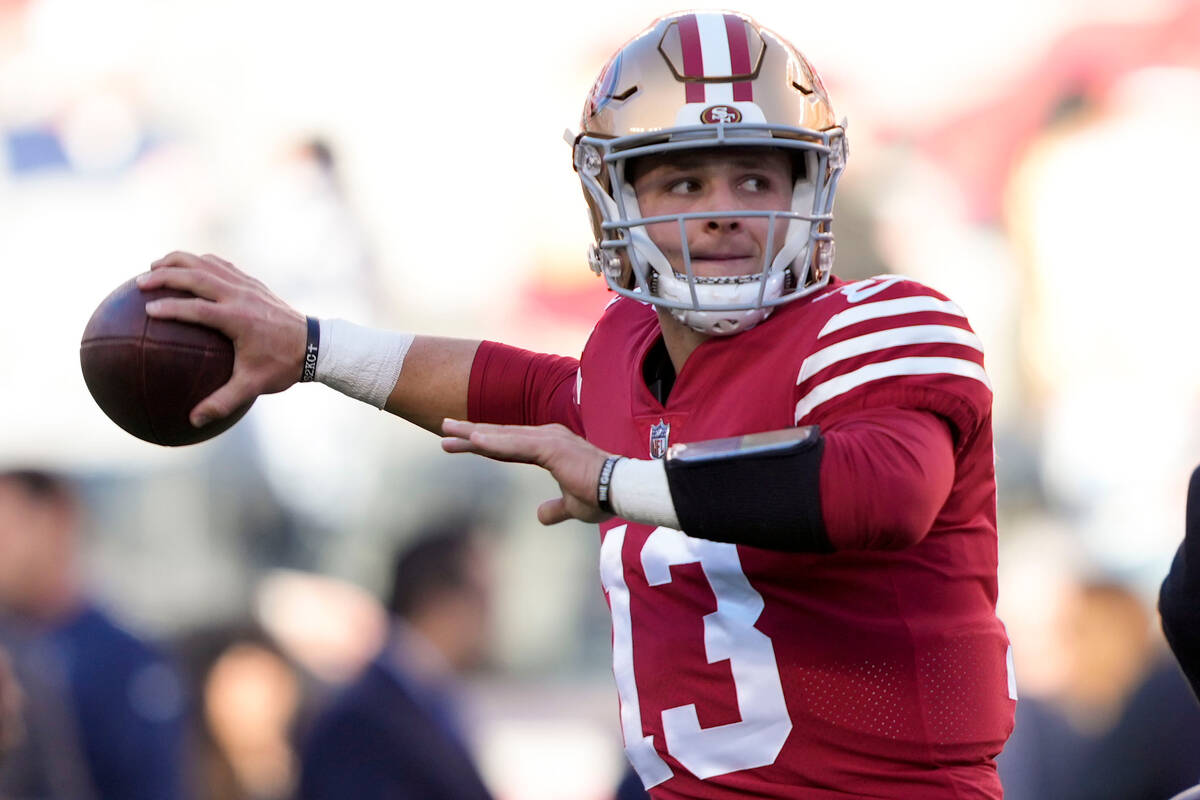 San Francisco 49ers quarterback Brock Purdy (13) warms up before an NFL divisional round playof ...