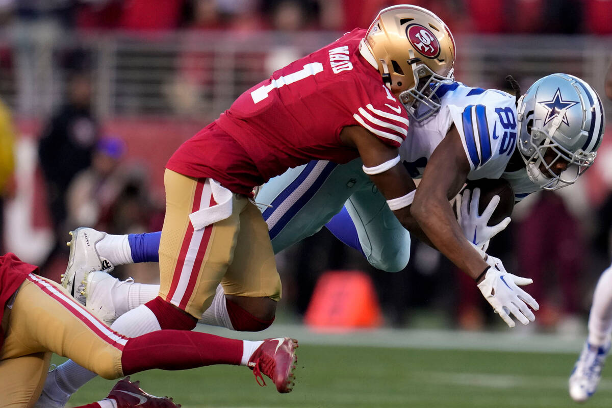 San Francisco 49ers cornerback Jimmie Ward (1) tackles Dallas Cowboys wide receiver Noah Brown ...