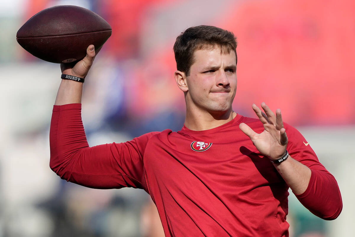San Francisco 49ers quarterback Brock Purdy warms up before an NFL divisional round playoff foo ...
