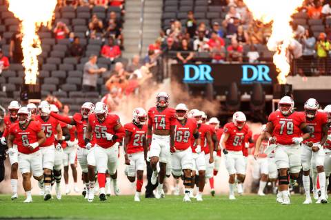 FILE - UNLV Rebels take the field before the start of a NCAA football game against Idaho State ...