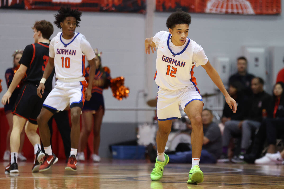 Bishop Gorman's Quentin Rhymes (12) reacts after scoring a 3-point-shot against Coronado during ...