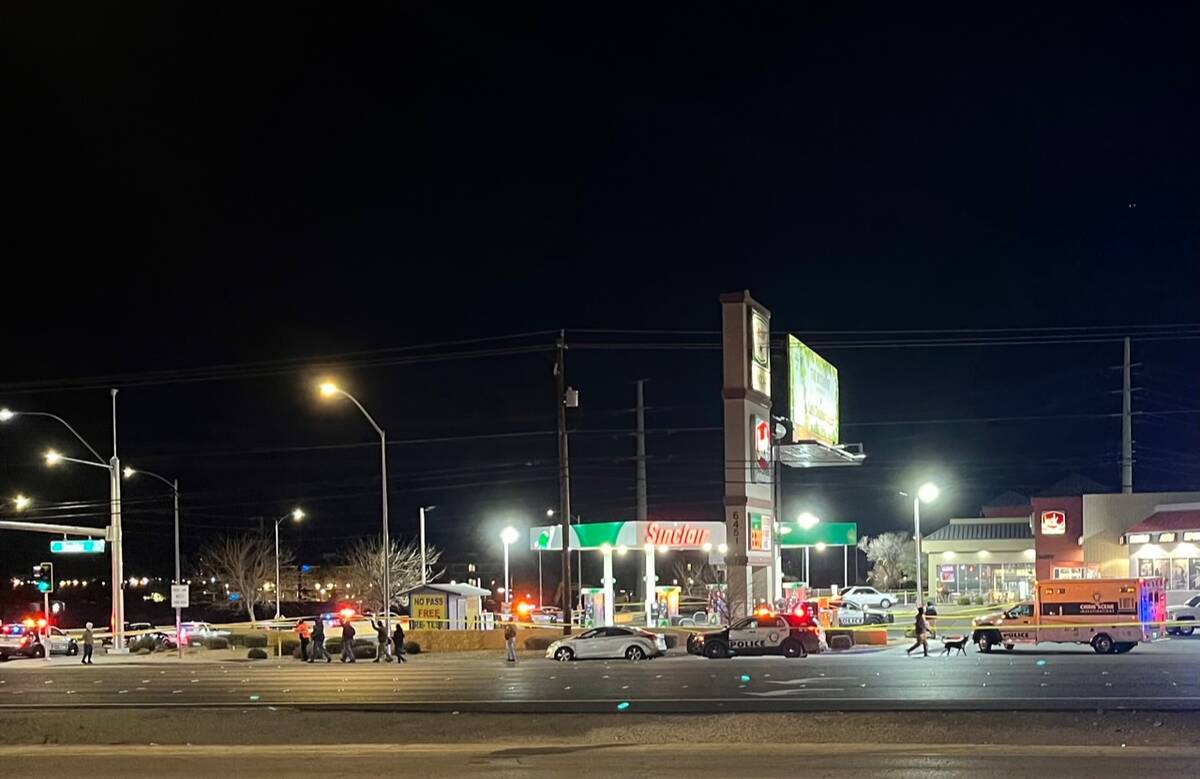 Police investigate a fatal shooting outside a gas station at Boulder Highway and Russell Road o ...