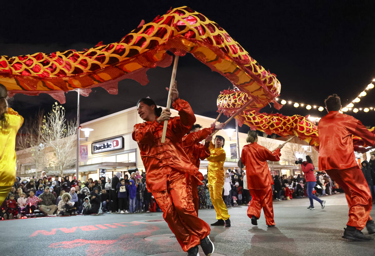 Best Agency performers entertain the crowd with a dragon dance during Downtown Summerlin's Luna ...