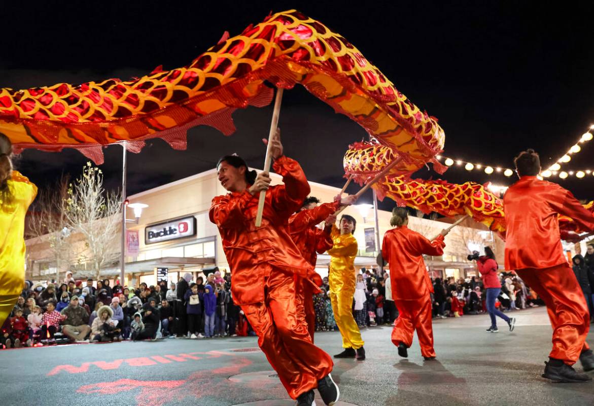 Best Agency performers entertain the crowd with a dragon dance during Downtown Summerlin's Luna ...