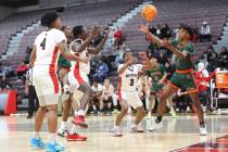 Mojave's Zaccarion Jackson (1) reaches for the rebound against Las Vegas' Tayshaun Jackson (3) ...