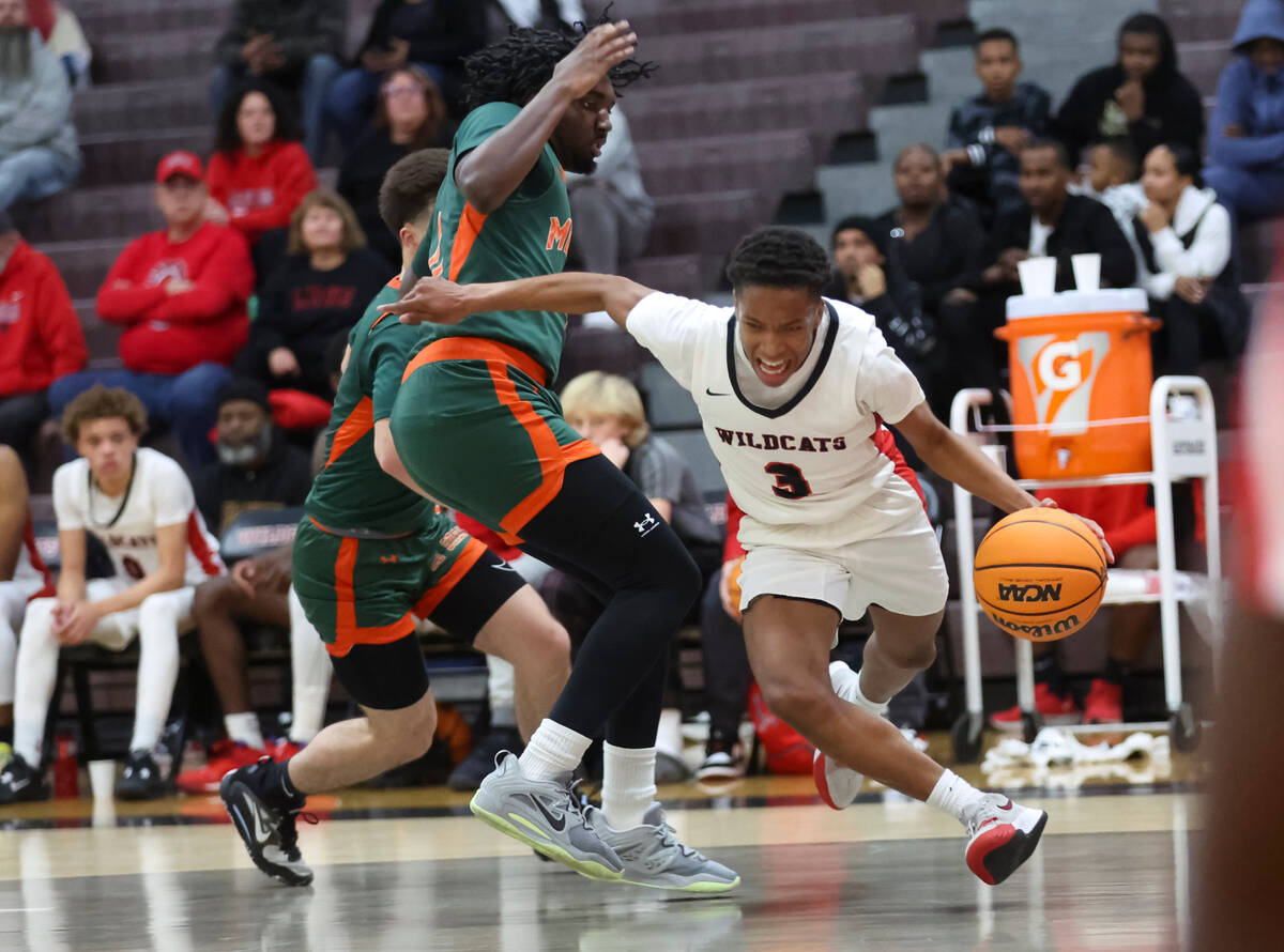 Las Vegas' Tayshaun Jackson (3) drives the ball around Mojave's Zarshon Cousin (11) during the ...
