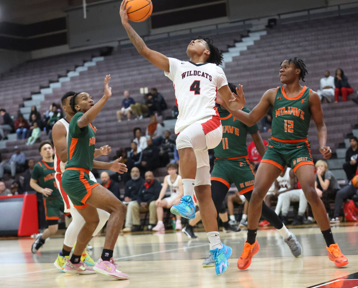 Las Vegas' Marcus Gomez (4) lays up the ball against Mojave during the second half of a basketb ...
