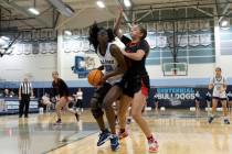 Centennial’s Asani Caeser (32) shoots against Coronado’s Gabby Brooks (11) during a girls h ...