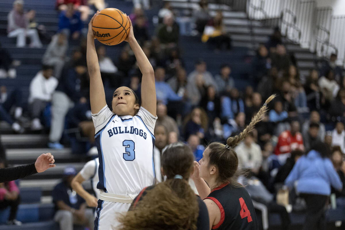 Centennial’s Charlece Ohiaeri (3) jumps to shoot against Coronado’s Savannah Lope ...