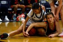 Spring Valley's Charolette Delisle (21) and Coronado's Savannah Lopez (4) battle for a loose ba ...