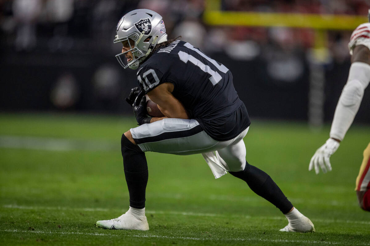 Raiders wide receiver Mack Hollins (10) makes a catch during the first half of an NFL game agai ...