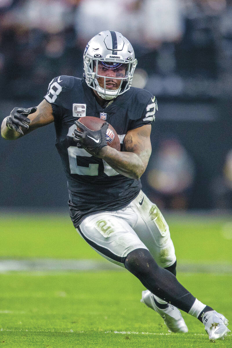 Raiders running back Josh Jacobs (28) runs against the San Francisco 49ers during the first hal ...