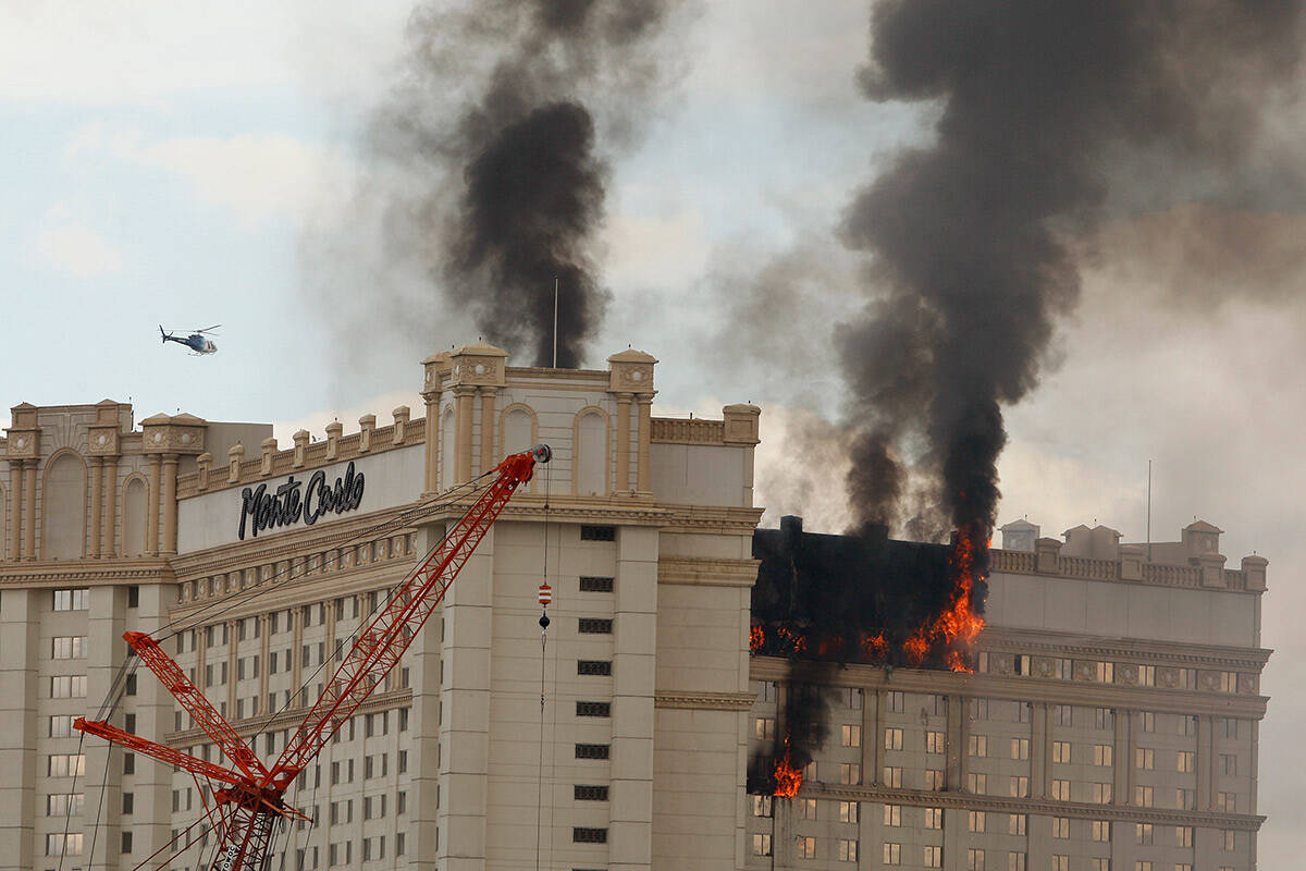 Smoke and fire rise from the facade of the Monte Carlo hotel-casino on Friday, Jan. 25, 2008, i ...