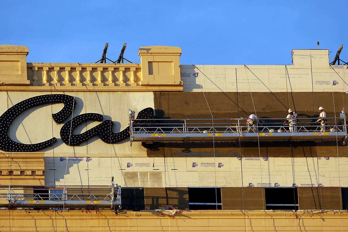 Workers repair the exterior of the Monte Carlo hotel-casino on Friday, Feb, 8, 2008, in prepara ...