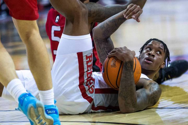 UNLV Rebels guard Elijah Parquet (1) and Incarnate Word Cardinals guard Brandon Swaby (5) look ...