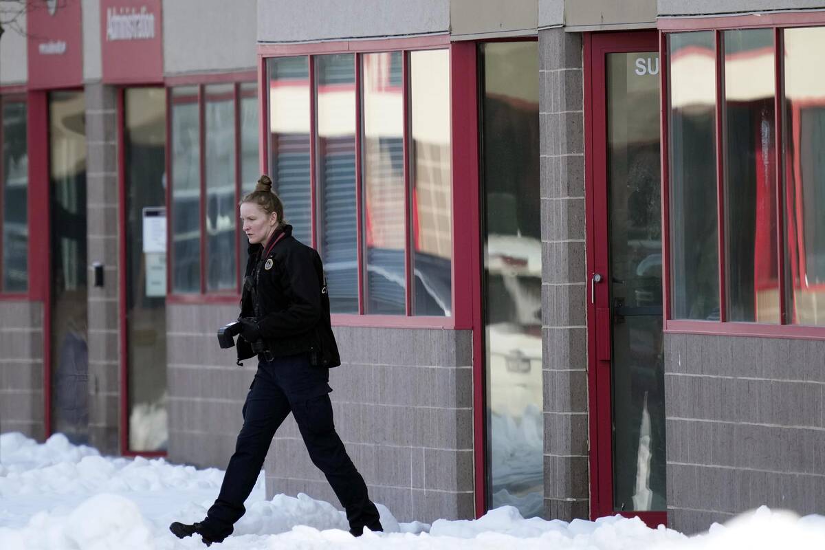 A law enforcement officer exits the Starts Right Here building, Monday, Jan. 23, 2023, in Des M ...