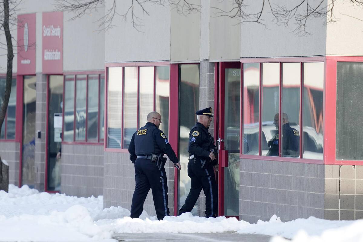 Law enforcement officers enter the Starts Right Here building, Monday, Jan. 23, 2023, in Des Mo ...