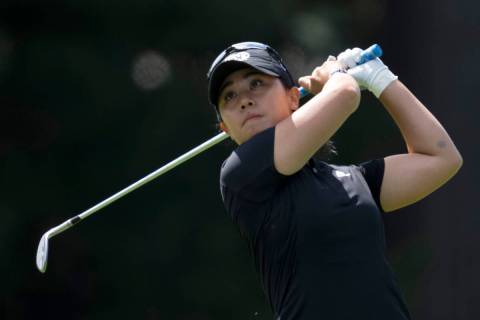 Danielle Kang, from the United States, watches an approach shot on the 3rd hole during the thir ...