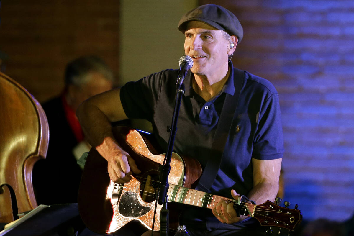 FILE - In this Nov. 6, 2016 file photo, musician James Taylor performs during a campaign event ...