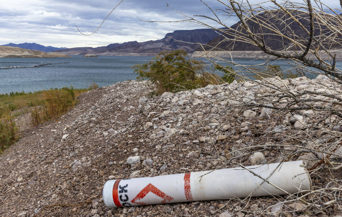 A floating marker buoy remains tethered to the ground formerly in the water as the level contin ...
